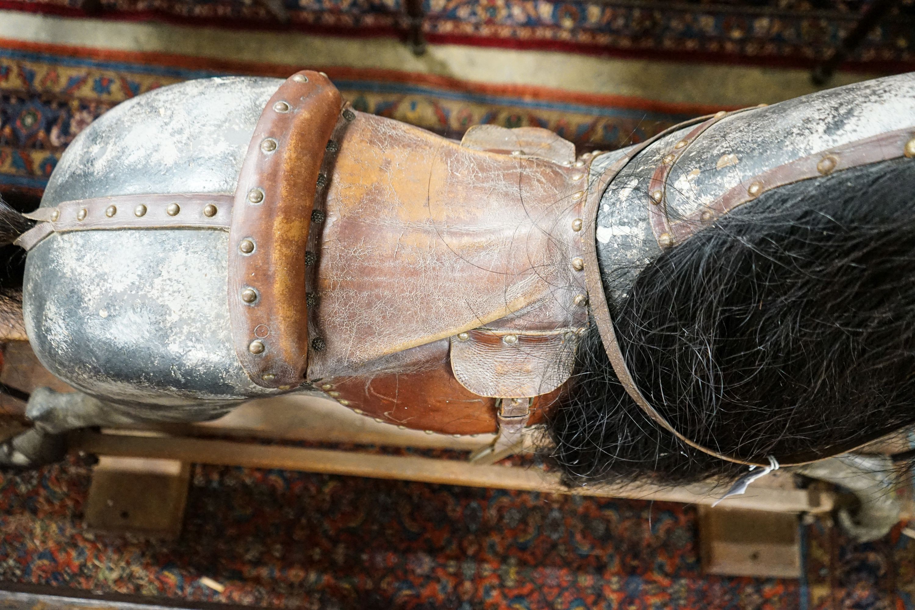 A large Edwardian Ayres type rocking horse on a turned safety frame, length 160cm, height 110cm